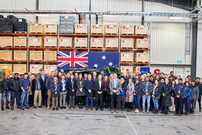 EOS R150 Production Line Opening-Team Shot with the R150 in the Background Mounted on the Denali Truck (1)